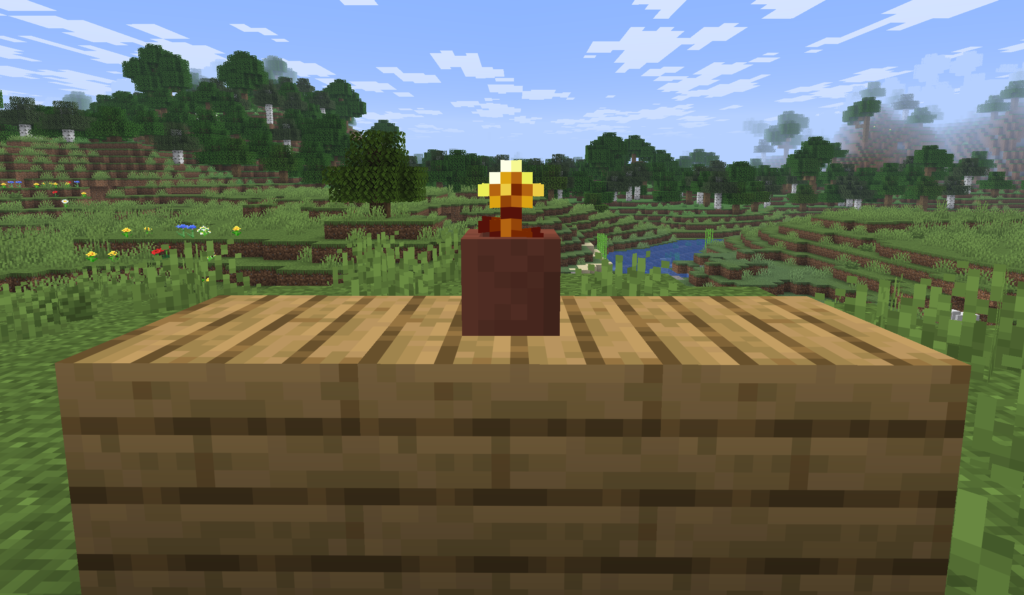 金のタンポポを植木鉢に入れた様子